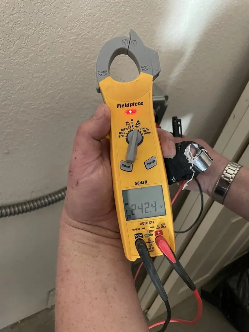 Voltage testing with clamp meter during Electrical Installation Services in Blackshear
